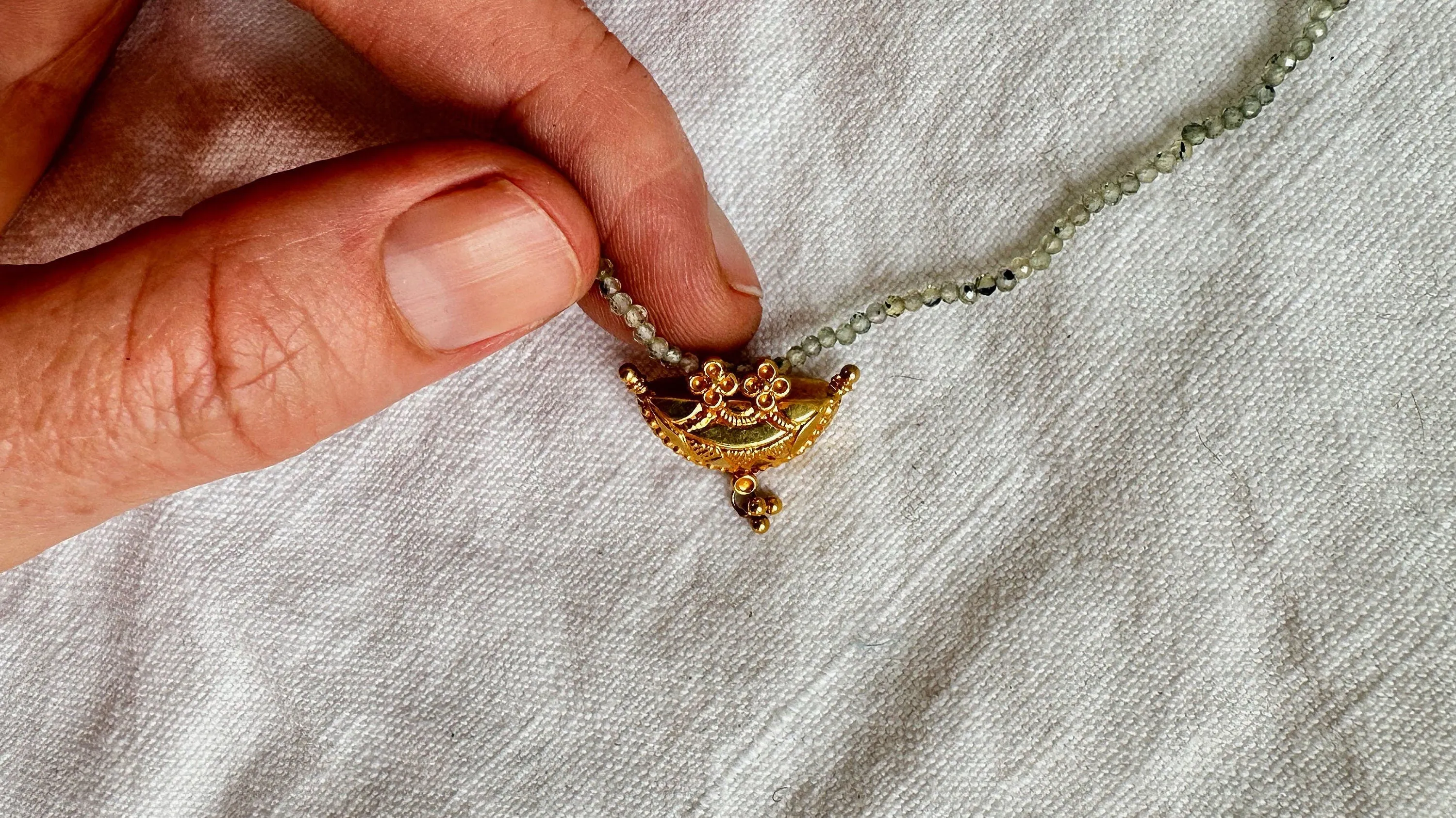Gold Amulet & Green Sapphire Beaded Necklace. 20kt. 2074